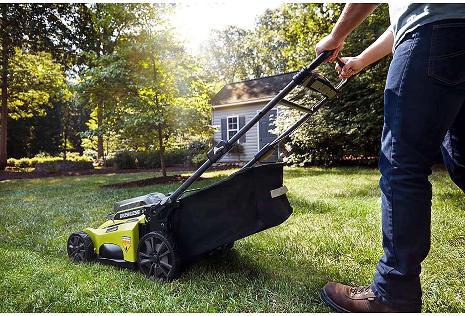 Ryobi electric lawnmower being used