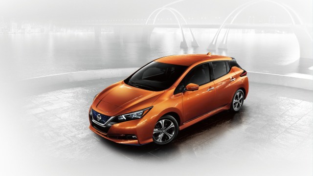 orange nissan leaf, the first mass-market electric car