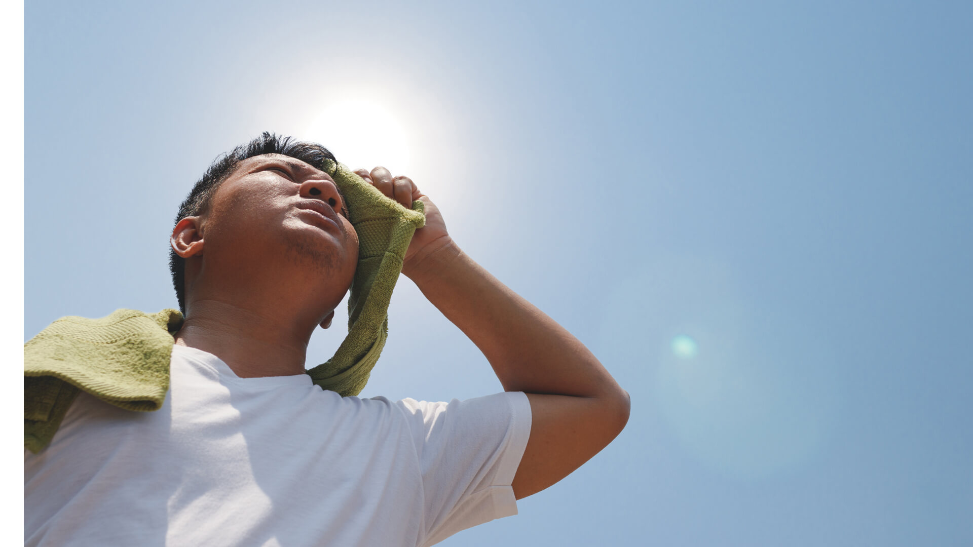 A person trying to cool body during a heatwave