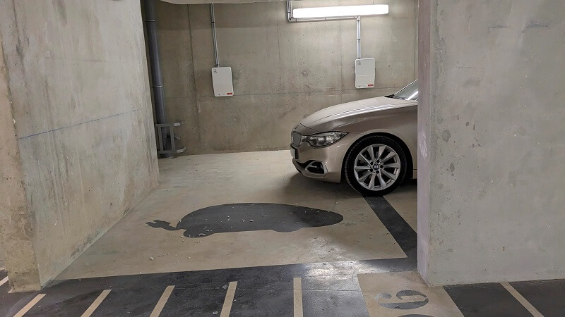 "Purposely blocking 3 reserved spaces for electric cars at my work."