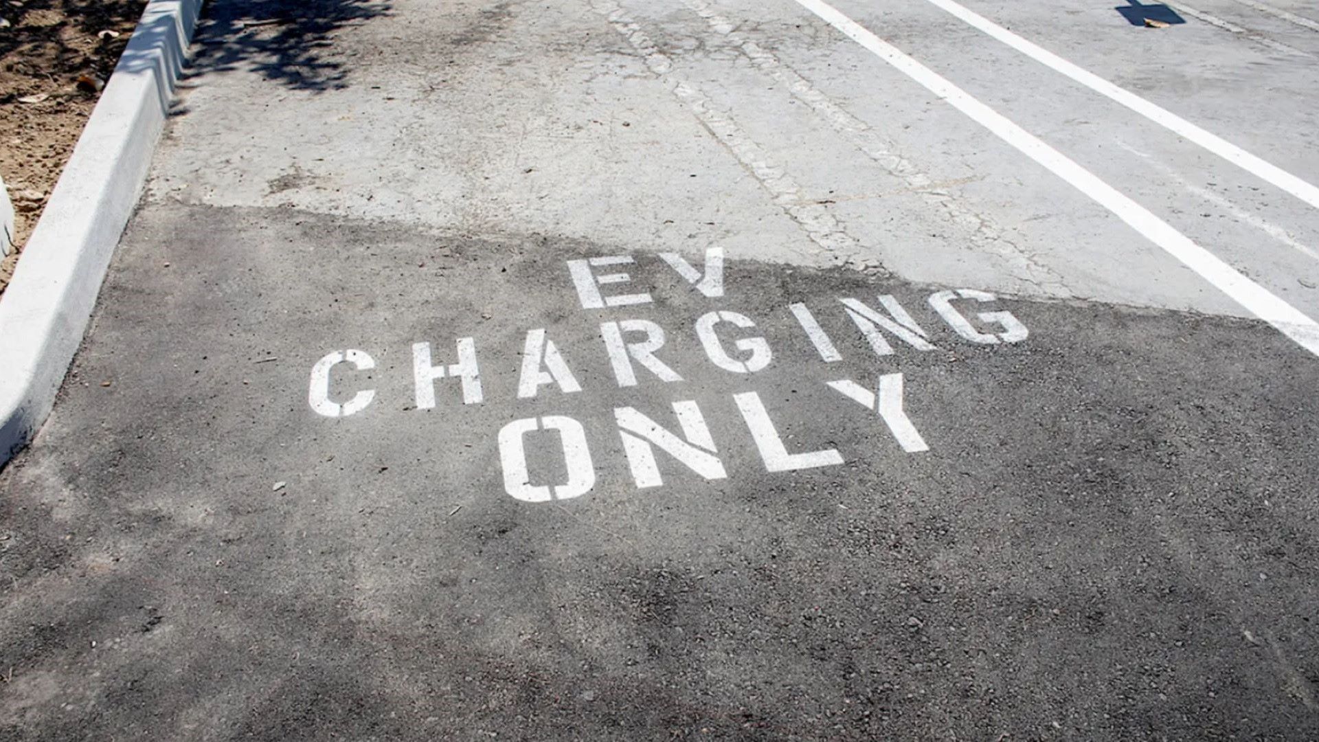 "Purposely blocking 3 reserved spaces for electric cars at my work."