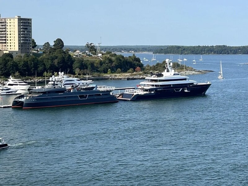 His yachts are well known and hard to miss, both for their unusual pairing and their sheer size.