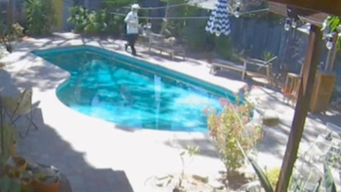 As caught by the security camera, the person lets out an audible sound of surprise.