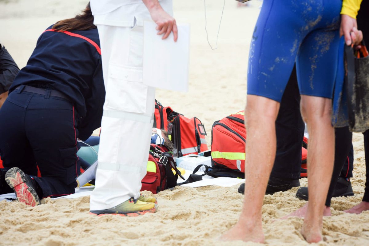 The animal bit her repeatedly before she was able to escape and swim to shore.