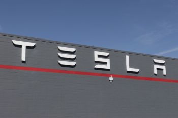 One Tesla employee says they were fired from the company because of an association with the letter.